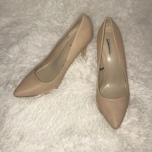 Cream colored pointed toe heels